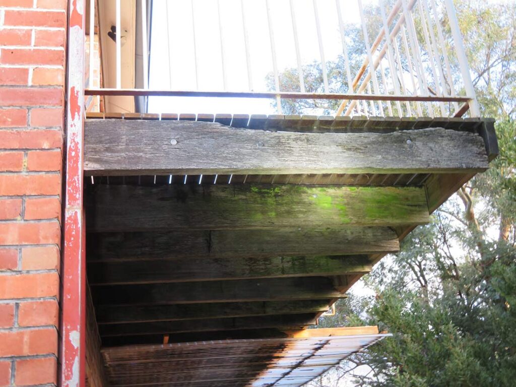 Timber balcony with rot and decay found during Hobart building inspection in New Town