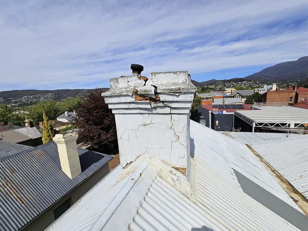 Cracked brick chimney with structural damage identified during Hobart building inspection